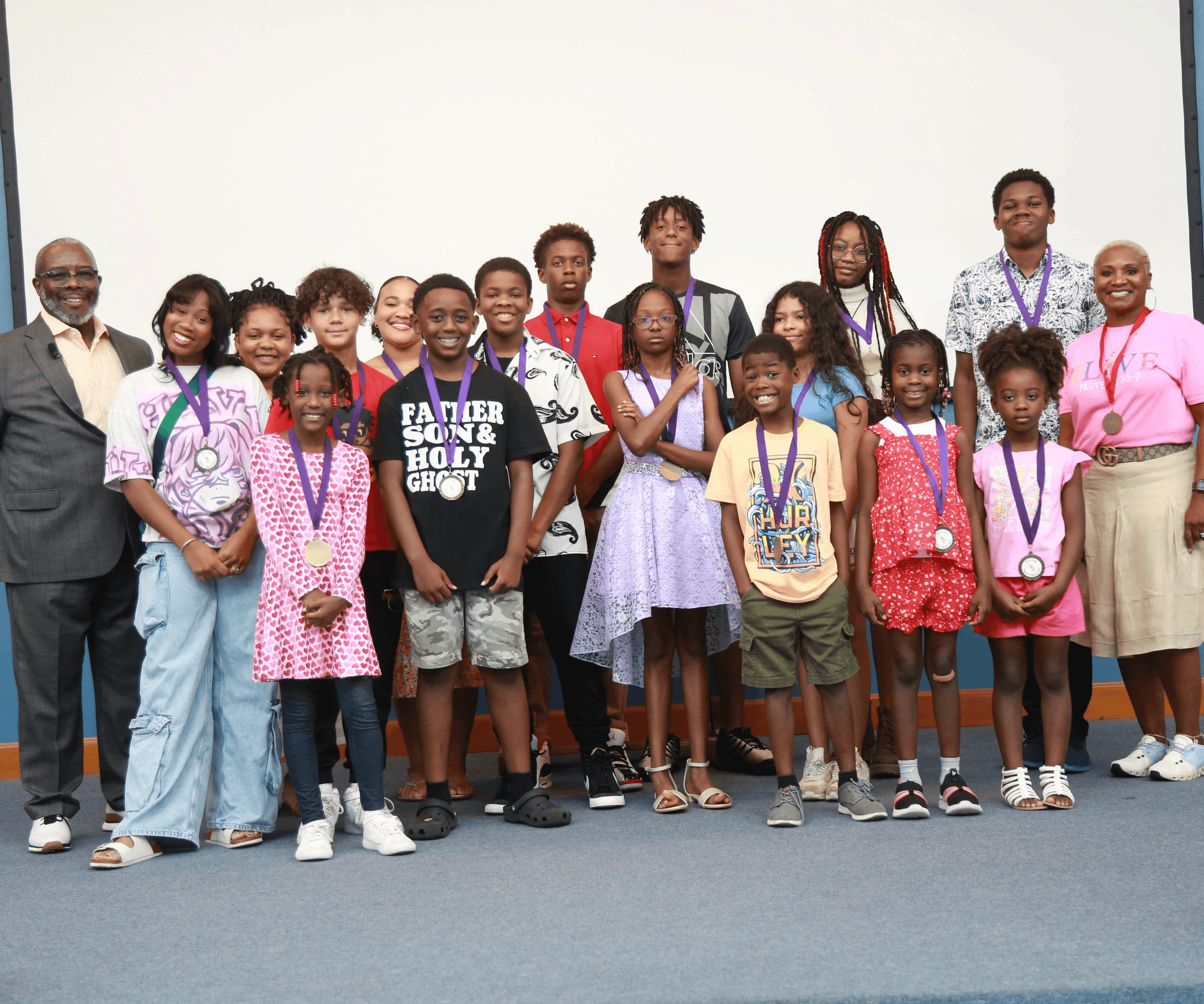 Youth and children standing together for recognition.