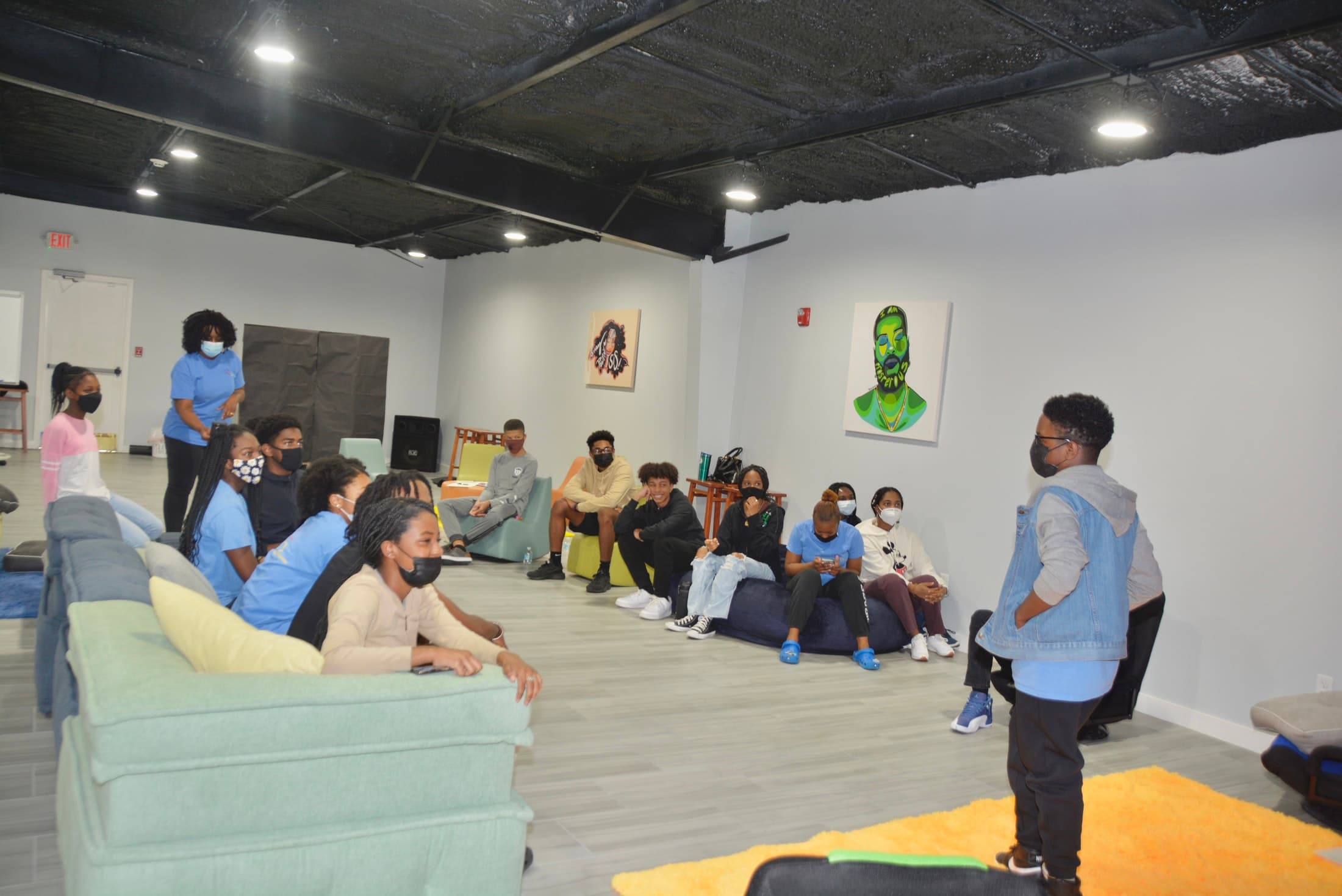 Youth students gathered together in discussion.